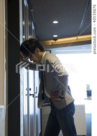Businessman falling down in the office Businessman falling down in the office 40539876