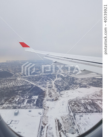 Earth, city and plane wing 40539921