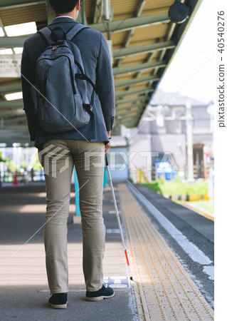 Male photography cooperation using white cane "Keio Electric Railway Co., Ltd." 40540276