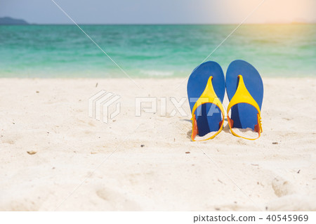 Beach sandals on the sandy sea coast, summer concept holiday and 40545969
