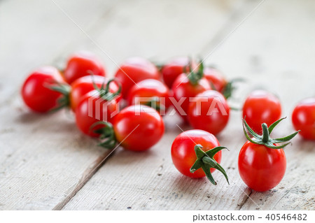 Fresh cherry tomatoes on rustic wooden background. 40546482