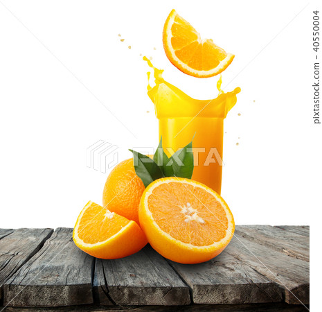 Glass of orange juice with splash and oranges on wooden table Glass of orange juice with splash and oranges on wooden table 40550004