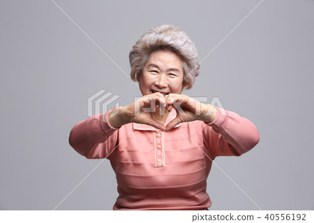 Asian woman's facial expression, senior, middle-aged, elderly, grandmother, close-up, laughing, happiness, emotion, health 40556192