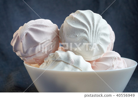White zephyr marshmallow on porcelain plate White zephyr marshmallow on porcelain plate 40556949