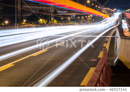 Traffic at night on a chinese elevated highway Traffic at night on a chinese elevated highway 40557141