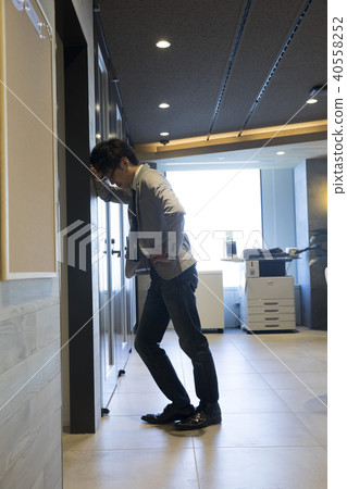 Businessman falling down in the office 40558252