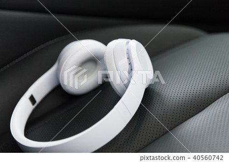 Wireless headphones on the car seat 40560742