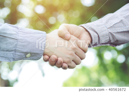 Close up of a business man hand shake Close up of a business man hand shake 40561672