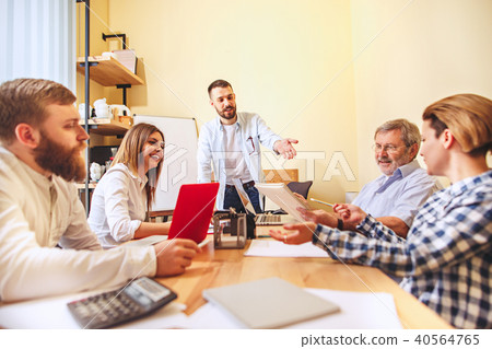 Team job. Photo young businessmans working with new project in office 40564765