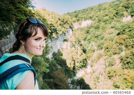 Zeda-gordi, Georgia. Beautiful Woman Posing For Photo On Narrow Zeda-gordi, Georgia. Beautiful Woman Posing For Photo On Narrow 40565468