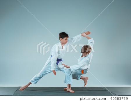 The two boys fighting at Aikido training in martial arts school. Healthy lifestyle and sports 40565759