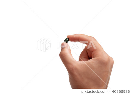 pill in man's hand on white background pill in man's hand on white background 40568926