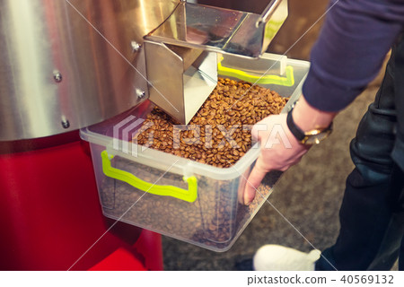 Coffee beans after roasting process in machine. Coffee beans after roasting process in machine. 40569132