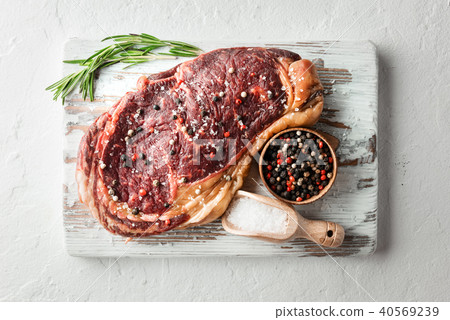 Marbling ribeye steak on white plate Marbling ribeye steak on white plate 40569239