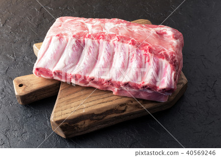 Fresh raw pork piece on wooden board 40569246
