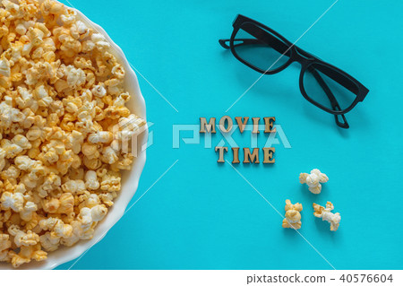 popcorn, TV remote 3D glasses. Text movie Time popcorn, TV remote 3D glasses. Text movie Time 40576604