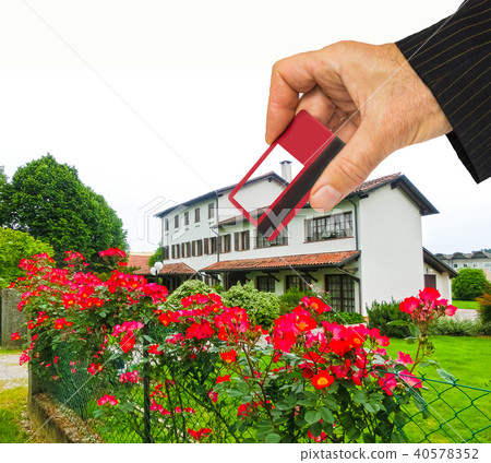 Hand with house and credit card, buy house concept 40578352