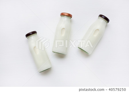 Milk bottle on white background. 40579250