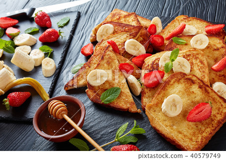 French toasts with fruits and mint French toasts with fruits and mint 40579749