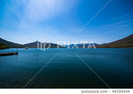 Lake Chuzenji Lake in May, sightseeing boat and snow on Nikko Shirane mountain Super wide angle 40580494