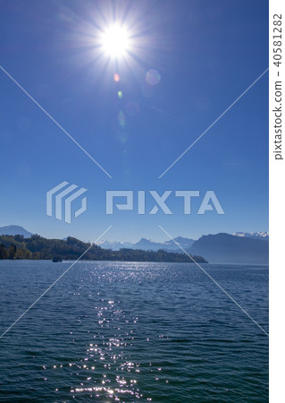 Blue sky and Alps seen from Lake Lucerne in Switzerland Blue sky and Alps seen from Lake Lucerne in Switzerland 40581282