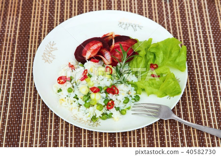 Baked beetroot,rice,pea and pepper on plate. Baked beetroot,rice,pea and pepper on plate. 40582730