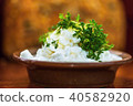 Cottage cheese on golden background. 40582920