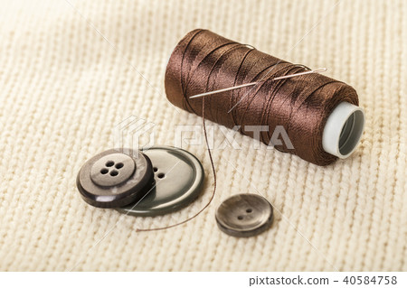 colored thread and buttons 40584758