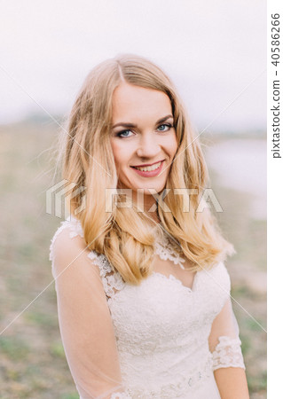 Portrait of the smiling blonde bride. Portrait of the smiling blonde bride. 40586266