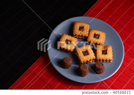 Chocolate sand chip cookies stacked up on a plate Chocolate sand chip cookies stacked up on a plate 40588015