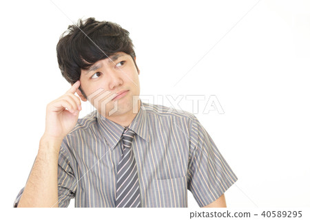 An agonizing businessman An agonizing businessman 40589295
