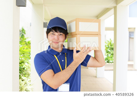 A man with a smile carrying baggage A man with a smile carrying baggage 40589326