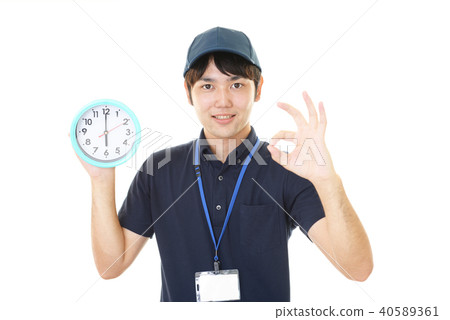 Smiling worker with a clock Smiling worker with a clock 40589361