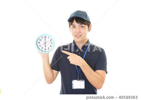 Smiling worker with a clock Smiling worker with a clock 40589363
