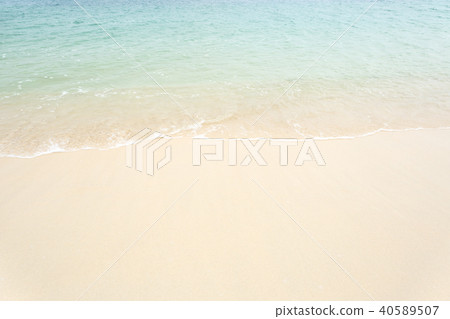 Beautiful ocean wave on white sandy beach Beautiful ocean wave on white sandy beach 40589507