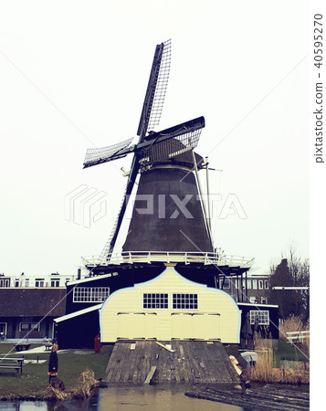 Windmills over dark sky in utrecht Windmills over dark sky in utrecht 40595270