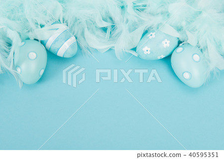 Blue decoration easter eggs and blue feathers Blue decoration easter eggs and blue feathers 40595351