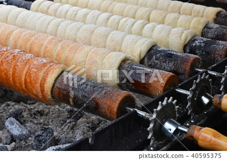 Close up baking chimney cake on grill Close up baking chimney cake on grill 40595375
