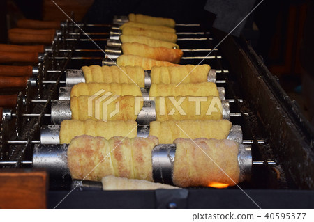 Close up baking chimney cake on grill 40595377