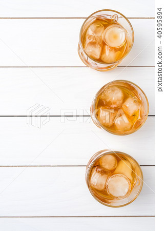 Whiskey glasses on white wooden table. Top view Whiskey glasses on white wooden table. Top view 40595894