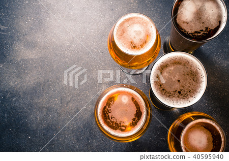 Beer glasses on dark table. Top view Beer glasses on dark table. Top view 40595940