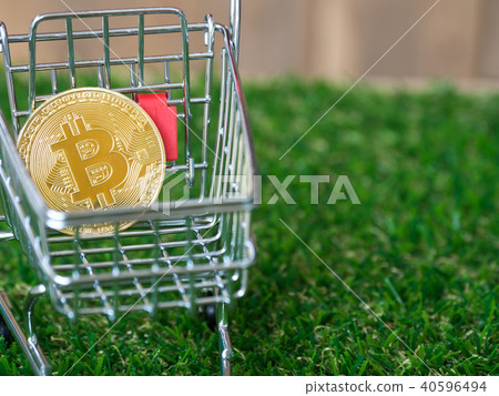 Golden bitcoin Cryptocurrency in red shopping cart Golden bitcoin Cryptocurrency in red shopping cart 40596494