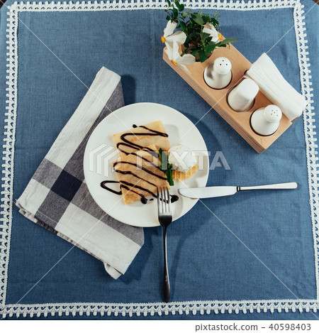 delicious pancakes with chocolate syrup and ice cream 40598403