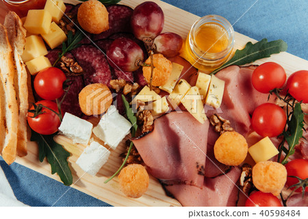 big group of meat, bread and vegetables 40598484