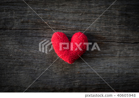 Alone handmade red heart  on wooden background.  40605948