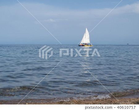 white sail in the sea 40610757