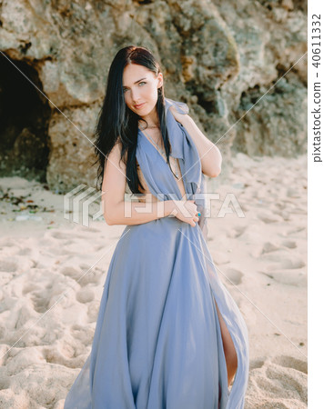 Portrait of bride in blue wedding dress at beach Portrait of bride in blue wedding dress at beach 40611332