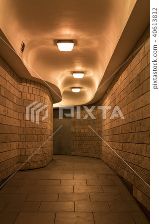 a curving pedestrian tunnel (subway) in London a curving pedestrian tunnel (subway) in London 40613812