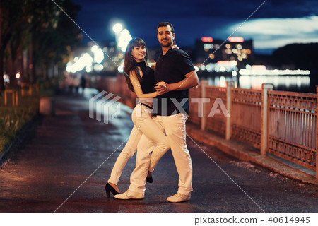 young couple dancing tango on the embankment 40614945