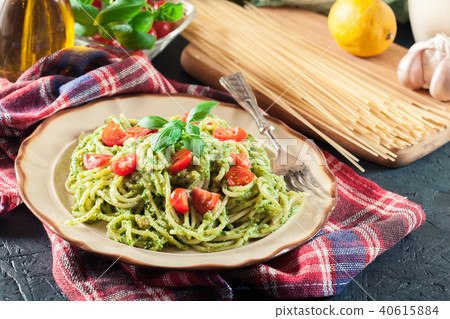 Vegetarian pasta spaghetti with basil pesto 40615884